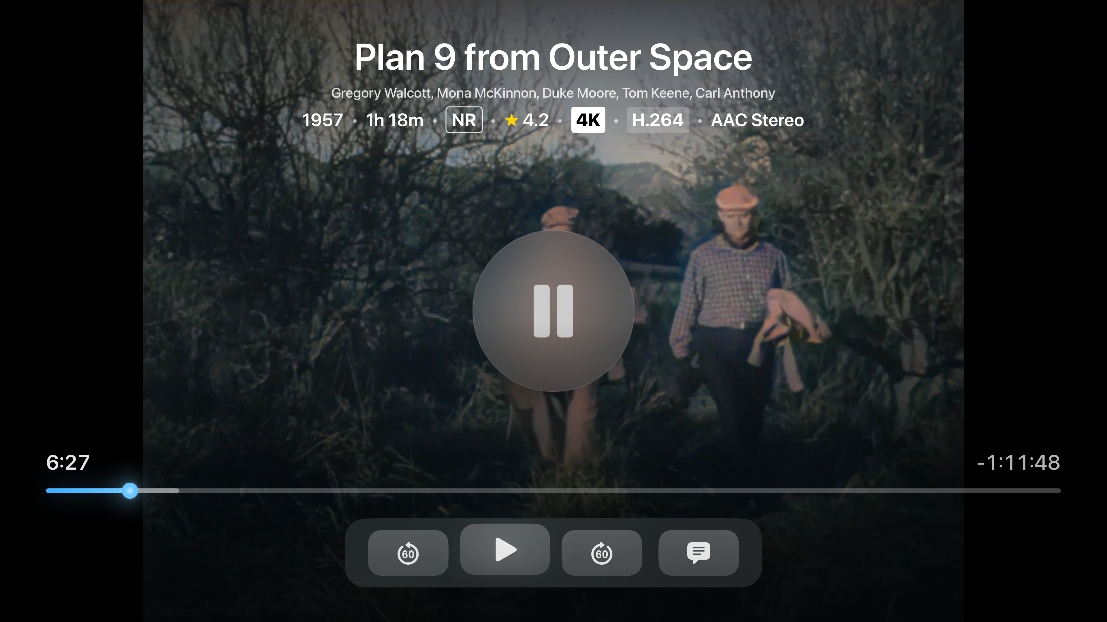 Trovu video player on Apple TV showing playback controls, media info, and progress bar for a Jellyfin movie